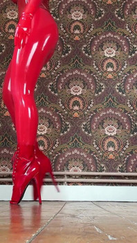 Red Ballet Boots on Wooden Floor