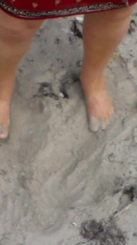 Jen Shows up Her Naked Feet in the Sand