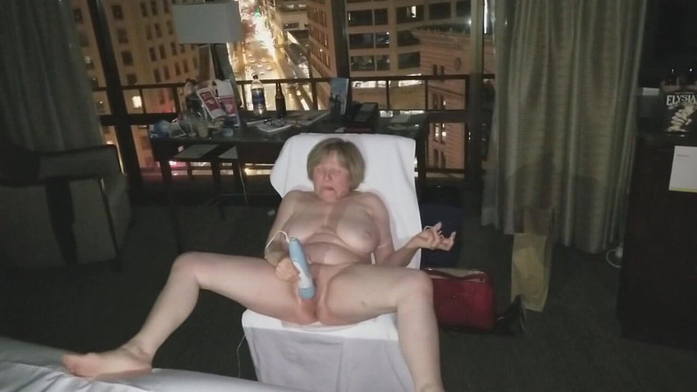 MarieRocks: See the 63-year-old hottie masturbating in a hotel room window