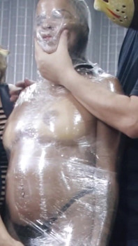Luana Mummified with Plastic Wrap