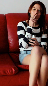 Skinny Redhead Smoking on a Couch