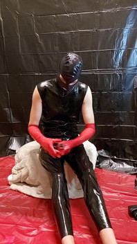Latex Catsuit and Red Latex Gloves