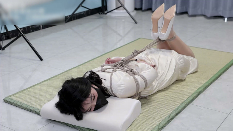 Asian bondage: Girlfriend in a Dress and Stockings, Bound by Rope