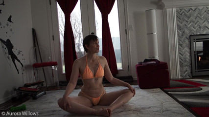 Aurora Willows: Stretching for your hamstrings in peach bikini
