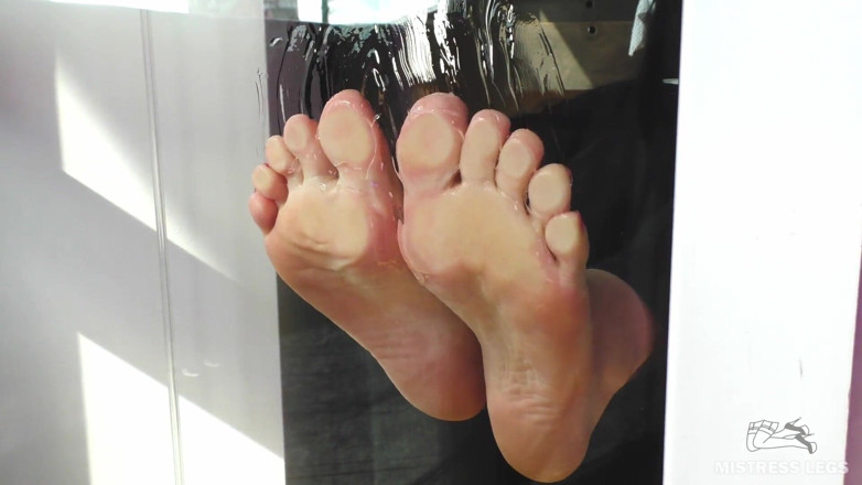Mistress Legs: Mistress barefoot soles rubbing against the glass and squeezing strawberries