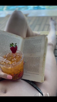 Reading by the Pool in a Bikini That Barely Counts as Spf