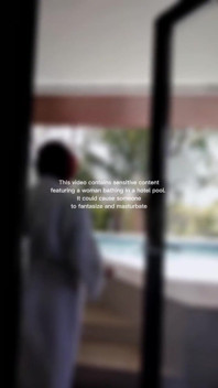 Woman Hijab Bathing Naked in an Open-air Hotel Pool