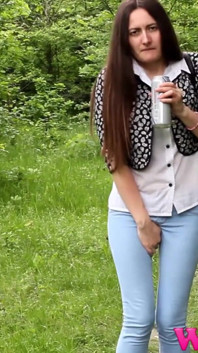 Diana Tries to Hold Her Pee Grabbing Her Crotch While She Is on a Walk Trough a Forest