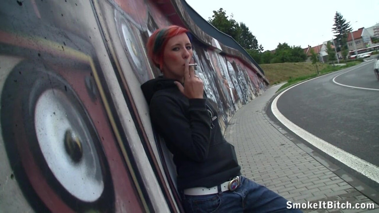 Smoke it bitch: Girl with colored hair & a pierced face smokes a cigar...