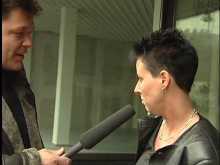 Lucky Cooch: A short-haired German girl was interviewed outdoor.