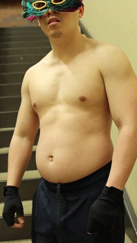 Flexing by the Stairs at the Gym