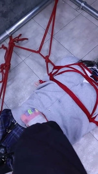 The Lovely Girlfriend Is Bound by Gloves, a Collar, and a Gag
