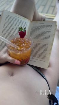 Reading by the Pool in a Bikini That Barely Counts as Spf
