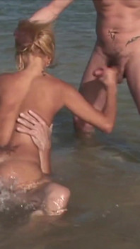 Ebony skin on the seashore is fucked by two big cocks that are eager for her hot holes