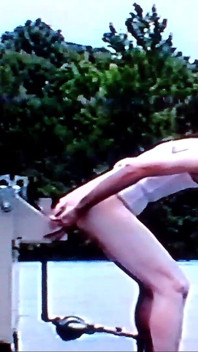 Crossdresser Riding a Giant Dildo on a Roof Top