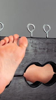 Maya Mineo with Her Feet in Stocks While Suzuka Kawai Stimulates Them with Various Objects