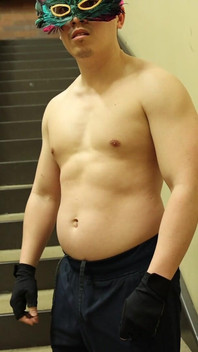 Flexing by the Stairs at the Gym