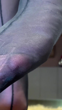 Goddess with Long Legs and Big Ass in Black Pantyhose on the Table Plays with a Toe Ring Above Your Face
