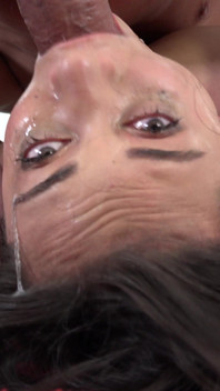 Brunette teen gags on a hard cock