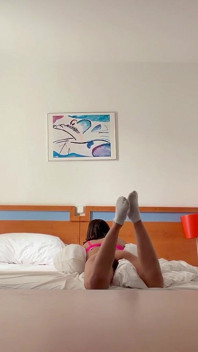 Woman Being Recorded in Hotel Room