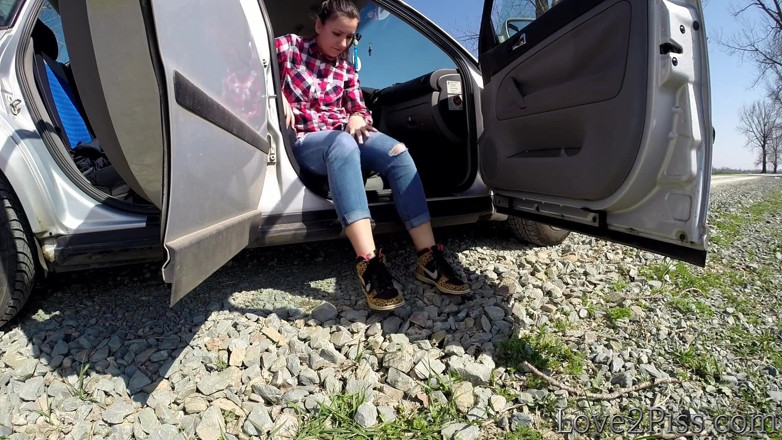 Love 2 Piss: She is almost caught peeing in front of a car