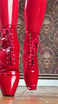Red Ballet Boots on Wooden Floor