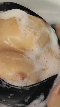 Taking a Bath in a Back Latex Catsuit