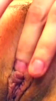 Seductive Brunette Strips and Fingers Her Dripping Pussy Wildly