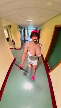 Busty Bimbo Walks Through the Hallway