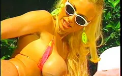 Gorgeous big-breasted blondes make love by the pool