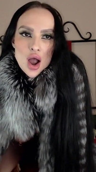 Bimbo in Fur Coat Plays with Dildo and Shows Tongue