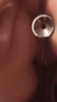Inserted an anal plug and a finger into it