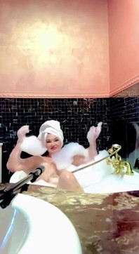 Stepmom Takes a Bath and Plays with Her Big Tits