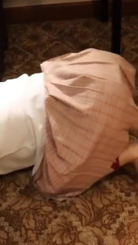 A Cute Little Dressed in a Jk Uniform Was Walking Around Barefoot on the Ground.