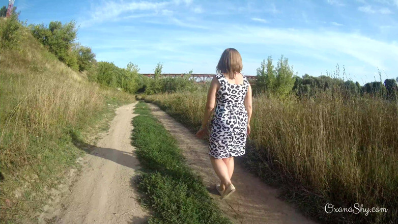 MILF Oxana: Flashing and naughty fun at the riverside
