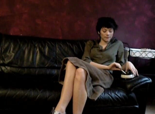 Femdom Austria: Black haired teen smoking a cigarette