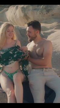 A Glimpse of Us Having Intimate Moments Outdoor on a Beach