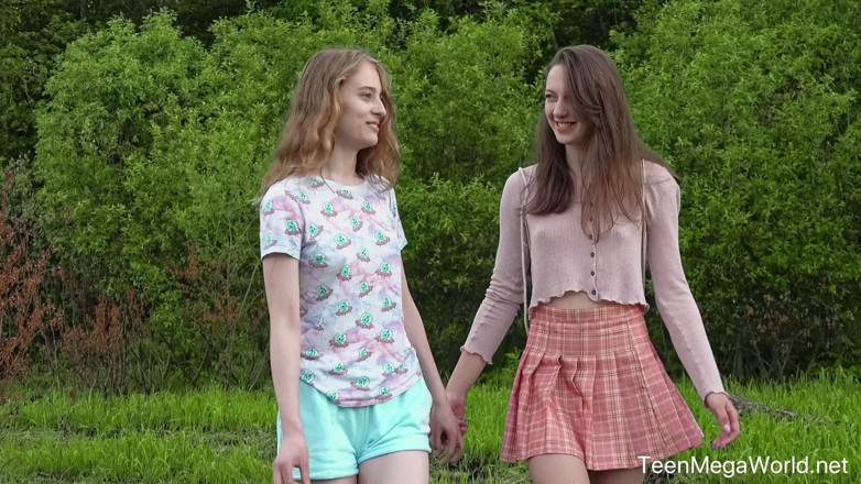 Teen Mega World: Hot Chicks Lick Clits in Field
