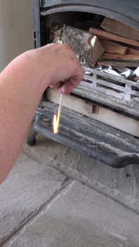 The maid - lighting the fire