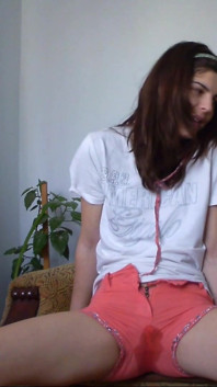 Sexy Teen Has Full Bladder and She Is Desperate to Pee so She Empty Her Bladder in Her Short Pants