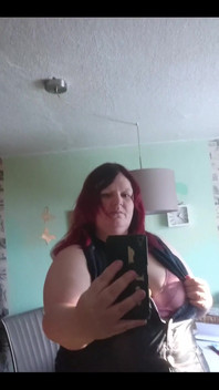 Showing off in a cool lab coat in front of the mirror