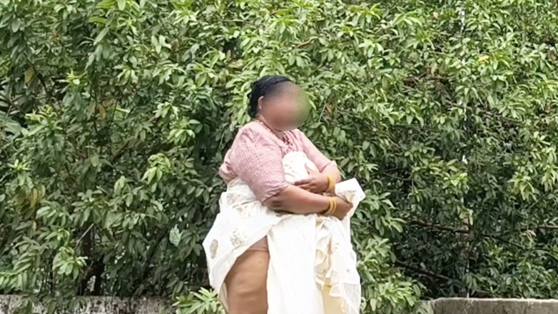 Anne Ipe: A Full-figured Woman in a White Skirt and Pink Top...