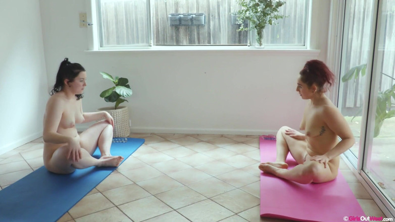 Girls Out West: Redhead and brunette masturbate with glass dildos during naked yoga