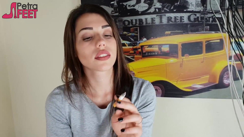 Smokin Fetish: Gorgeous brunette smokes a cigar in her bedroom