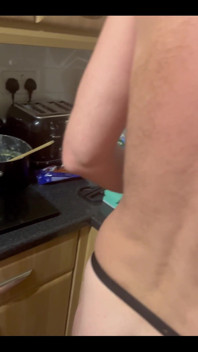 My Chastity Sub Washing the Pots for Me Naked in His Chastity Cage and with His Marigolds on