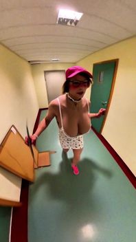 Busty Bimbo Walks Through the Hallway