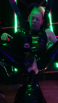 The rubber Domme the giant dildo and the gimp