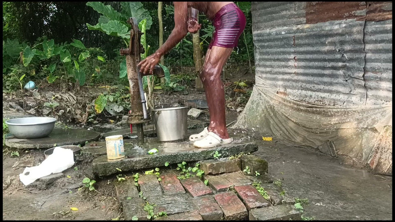 Ranjit Roy: Black mature man bath in desi style. Showing big dick.