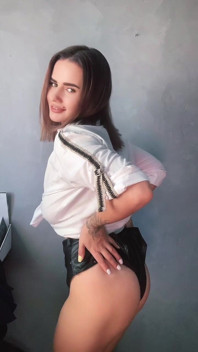 A Brunette in a White Shirt Is Ready to Bare Her Big Breasts