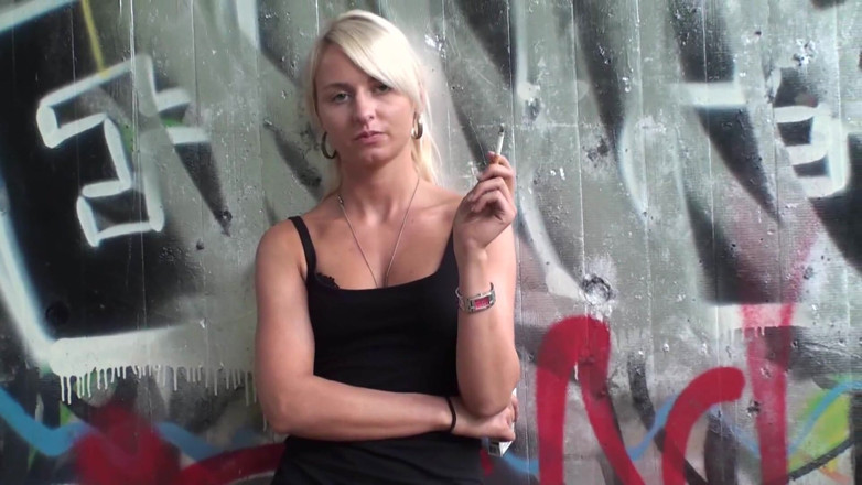 Femdom Austria: Lovely blonde teen smoking a cigarette outdoors